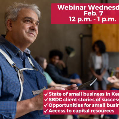An older male Hispanic business owner looks to the right with a slight smile and thoughtful look on his face. I in the somewhat blurred background are an ethnically diverse group of young people who look to be in their 20s. They many be customers or employees.
